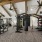 1-Bedroom Apartments in Land O' Lakes - Everwell at Bexley - Fitness Center With TRX Training Equipment, Large Ceiling Fans, and Weight Lifting Machines